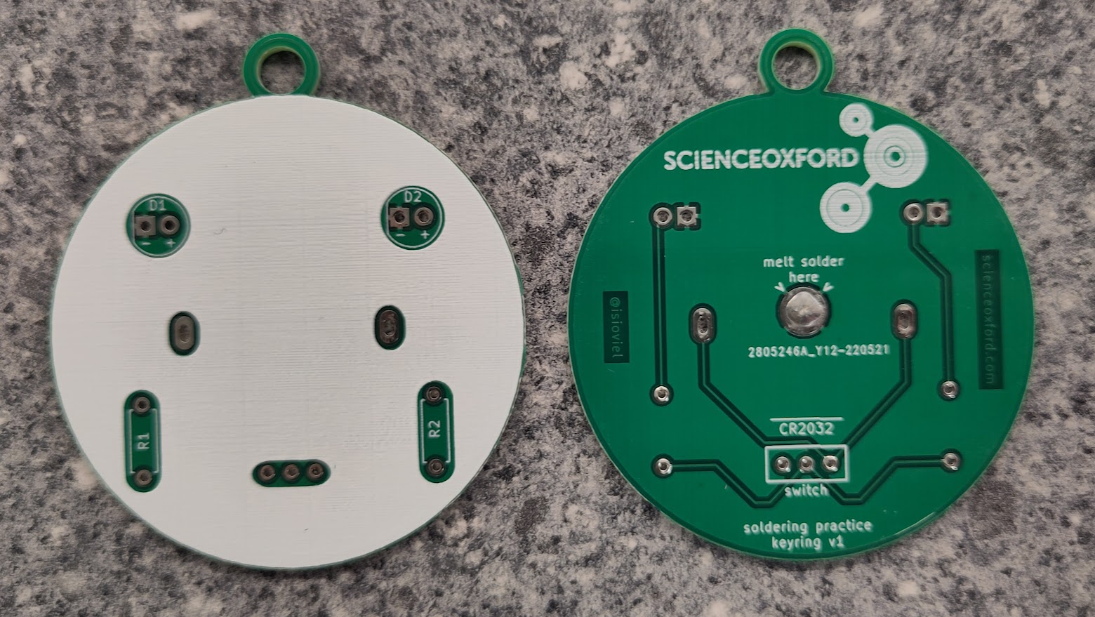 a photograph of a round printed circuit board with no components attached